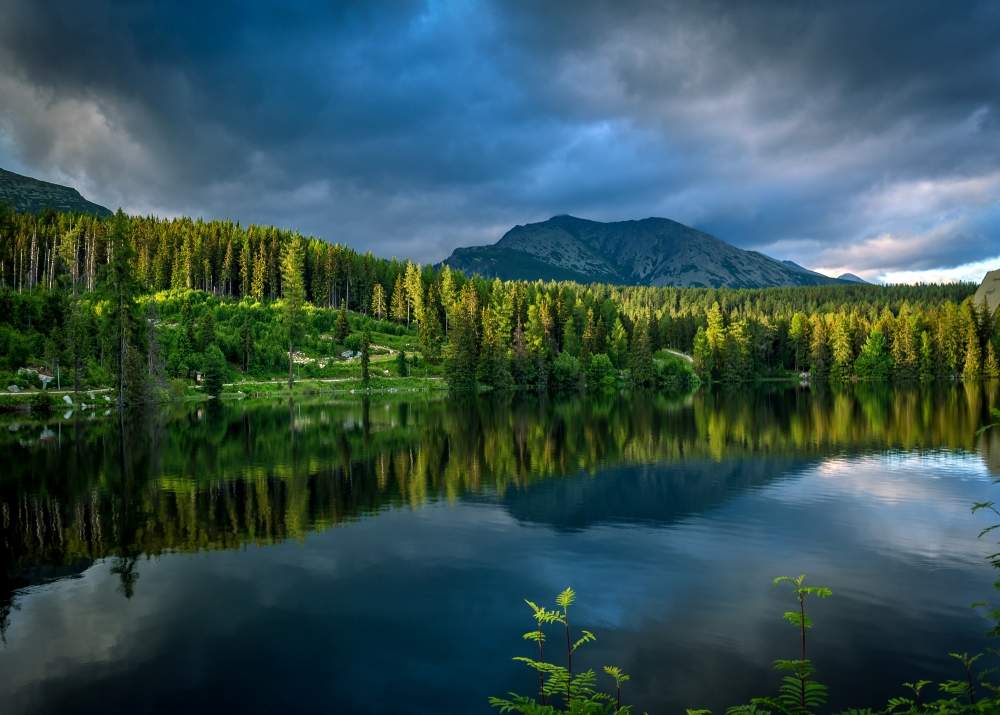 High Tatras lake with mountain reflections